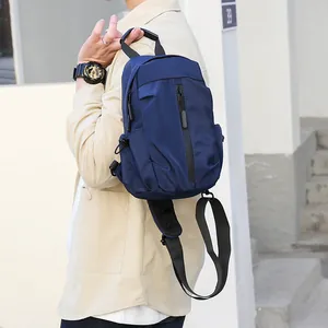 Waterproof navy blue nylon sling bag with ergonomic breathable mesh and wide strap