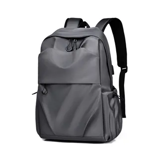 Waterproof dark grey travel backpack with USB port and padded straps for laptop
