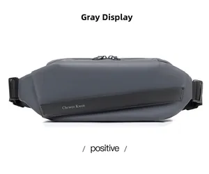 Detail view of grey water-resistant chest bag with magnetic buckle and matte texture
