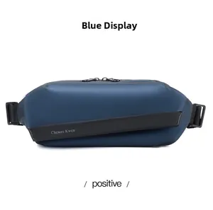 Front view of blue techwear fanny pack featuring a waterproof matte fabric and dual zippers
