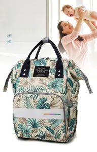 Detail of tropical plant print diaper bag featuring waterproof wet-dry separation storage