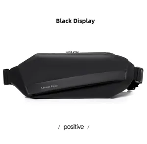 Detail of black crossbody bag showing matte waterproof fabric and magnetic buckle closure