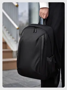 Detail view of water-resistant fabric and zippers on black business laptop backpack