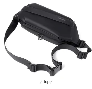 Top view of black waterproof nylon crossbody bag showing the zipper and adjustable strap