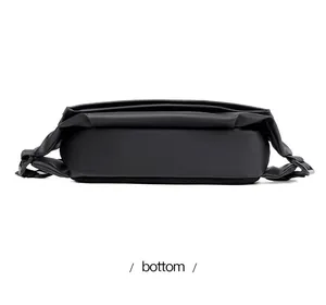 Detailed bottom view of black mini crossbody bag showing matte waterproof fabric texture