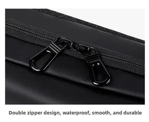 Macro shot of smooth waterproof fabric and durable dual metal zippers on black chest bag