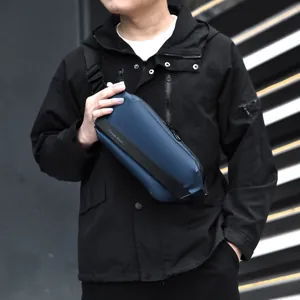 Waterproof navy blue men's chest bag with adjustable strap in urban outdoor setting