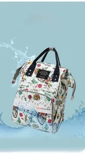 Waterproof floral diaper backpack with high-density fabric showing water splash resistance