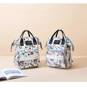 Waterproof multi-functional diaper backpack with floral and palm leaf prints
