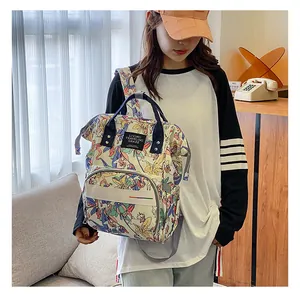 Detail of floral unicorn backpack with dual handles and waterproof fabric texture