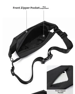 Detail of front zipper pocket on black oxford waist bag showing storage for smartphones