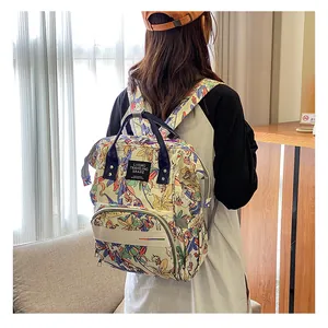 Detail of floral unicorn backpack with heavy-duty handles and front zipper pocket