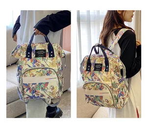 Detailed view of floral unicorn printed diaper bag with waterproof pockets and straps