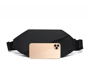 Size comparison of large black oxford fanny pack with a smartphone for scale