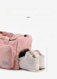 Pink travel gym bag featuring a 18cm independent side shoe compartment for storage