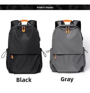 Front view of black and grey backpacks with orange zipper pulls and waterproof fabric