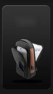 Detailed view of internal compartments and USB charging port on the crossbody bag