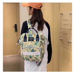 Detailed view of large-capacity floral backpack with waterproof fabric and front zip pocket