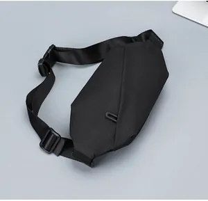 Detail of waterproof nylon waist bag showing geometric cut and adjustable strap buckle