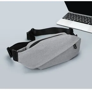 Detail of grey oxford chest bag with adjustable strap and dual zippers for commuting