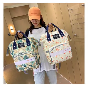 Close-up of lightweight mommy backpack with tropical leaf and cartoon bear prints