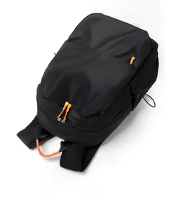 Top view of black backpack with orange accents showing large main compartment and zipper