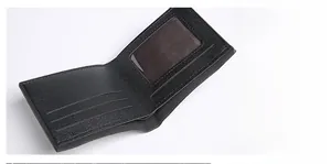 Detail view of black crocodile pattern wallet interior with card slots and ID window