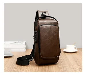 Detail of dark brown leather chest bag showing the security combination lock on the side