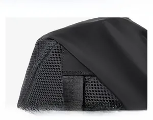 Detail showing the triangular reinforced stitching and breathable mesh of the black backpack