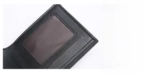 Detail of lychee pattern PU leather wallet with clear ID window and reinforced stitching
