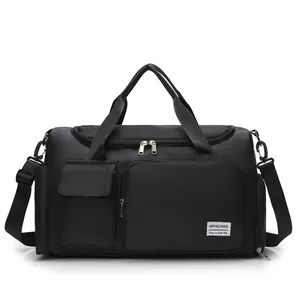 Detailed macro view of black waterproof nylon travel bag showing zippers and branding