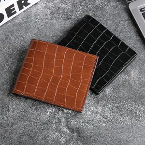 Men's crocodile texture bifold wallets in black and brown on a professional desk