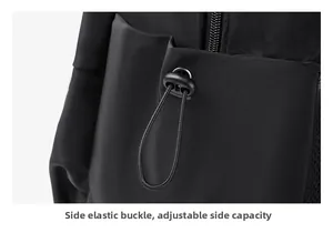 Detail of adjustable side elastic buckle and mesh pocket on the black nylon backpack