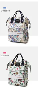 Detail view of large capacity diaper bags with unicorn and sparrow floral prints