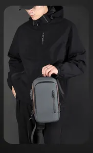 Detail view of water-resistant men's sling bag with anti-theft combination lock feature