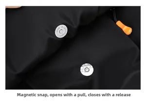 Detail of magnetic buckle closure on black backpack for quick release and secure closing