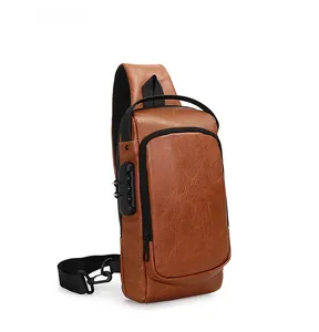 Detail view of the brown leather chest bag featuring a three-digit security combination lock
