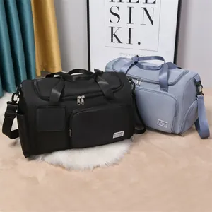 Spacious waterproof nylon travel bags in black and blue with adjustable shoulder straps