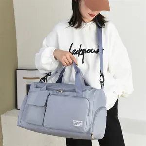 Light blue large capacity gym travel bag in oxford fabric with adjustable shoulder strap