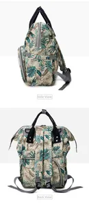 Detail view of tropical leaf diaper bag with side pockets and reinforced back straps