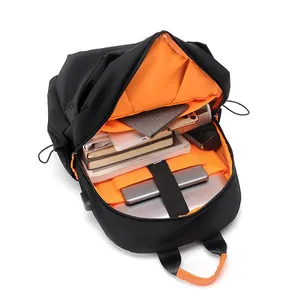 Black travel backpack with orange lining featuring large capacity laptop compartments