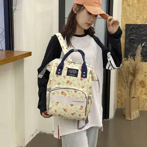 Large capacity waterproof diaper backpack with cute bear patterns and versatile straps