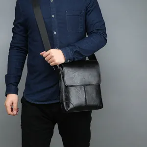 Men's black faux leather crossbody bag with vintage texture and flap closure design