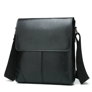 Classic black leather-textured crossbody bag for men with flap closure and adjustable strap