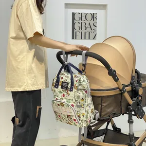 Floral waterproof diaper bag with large capacity and stroller hooks for stylish travel