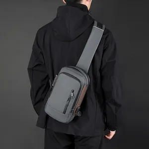 Men's waterproof gray crossbody bag with anti-theft lock and USB port for travel