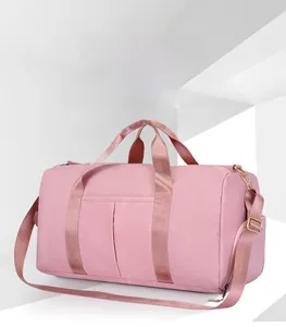 Detail view of pink large capacity fitness bag with waterproof nylon and metal buckles