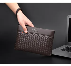 Detail of dark brown woven texture and kangaroo logo on men's leather clutch bag