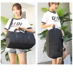 Black travel duffel bag for fitness with double handles and adjustable shoulder strap