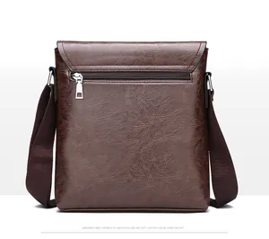 Detail view of the brown soft leather man's shoulder bag with rear metal zipper pocket